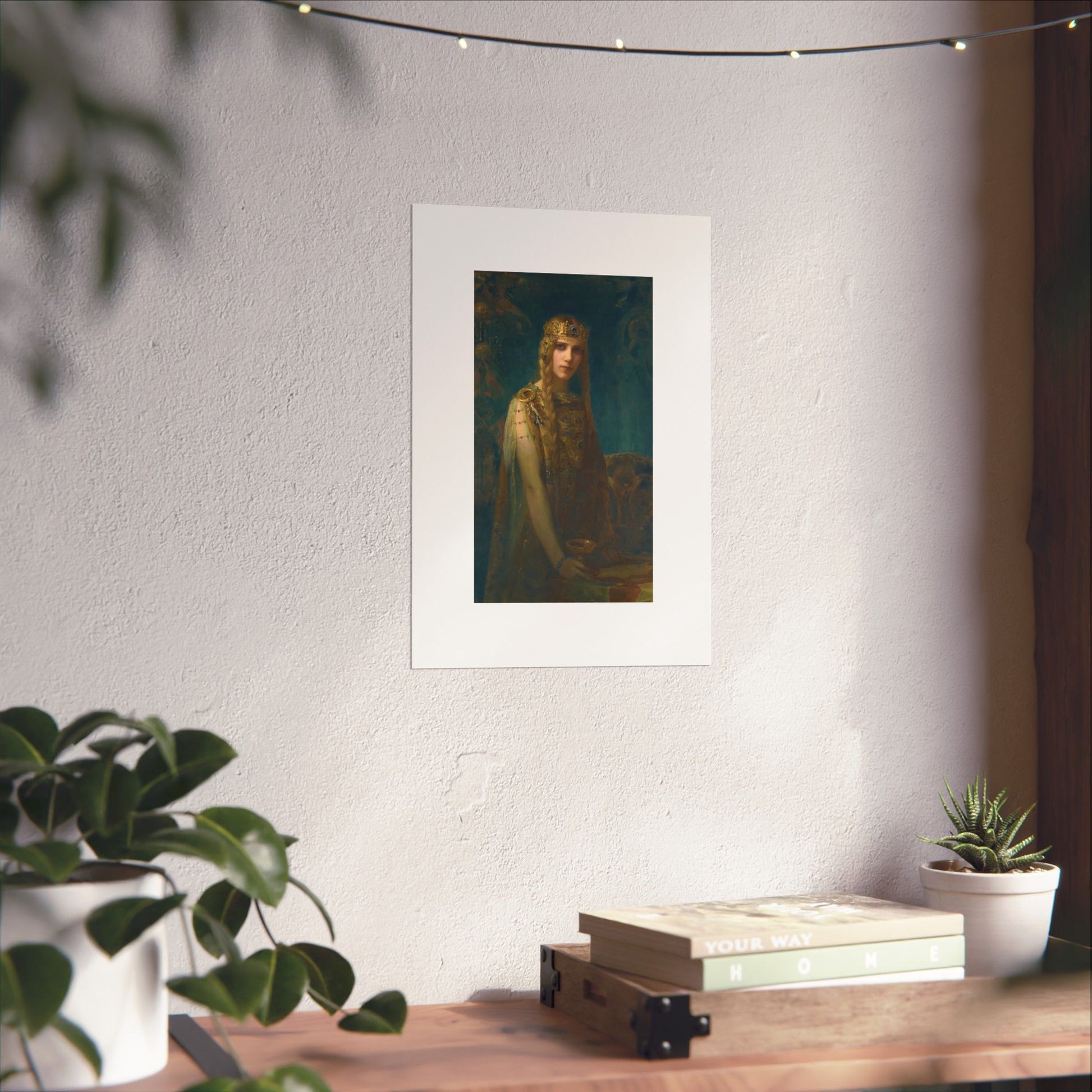 a picture of a woman is hanging on a wall