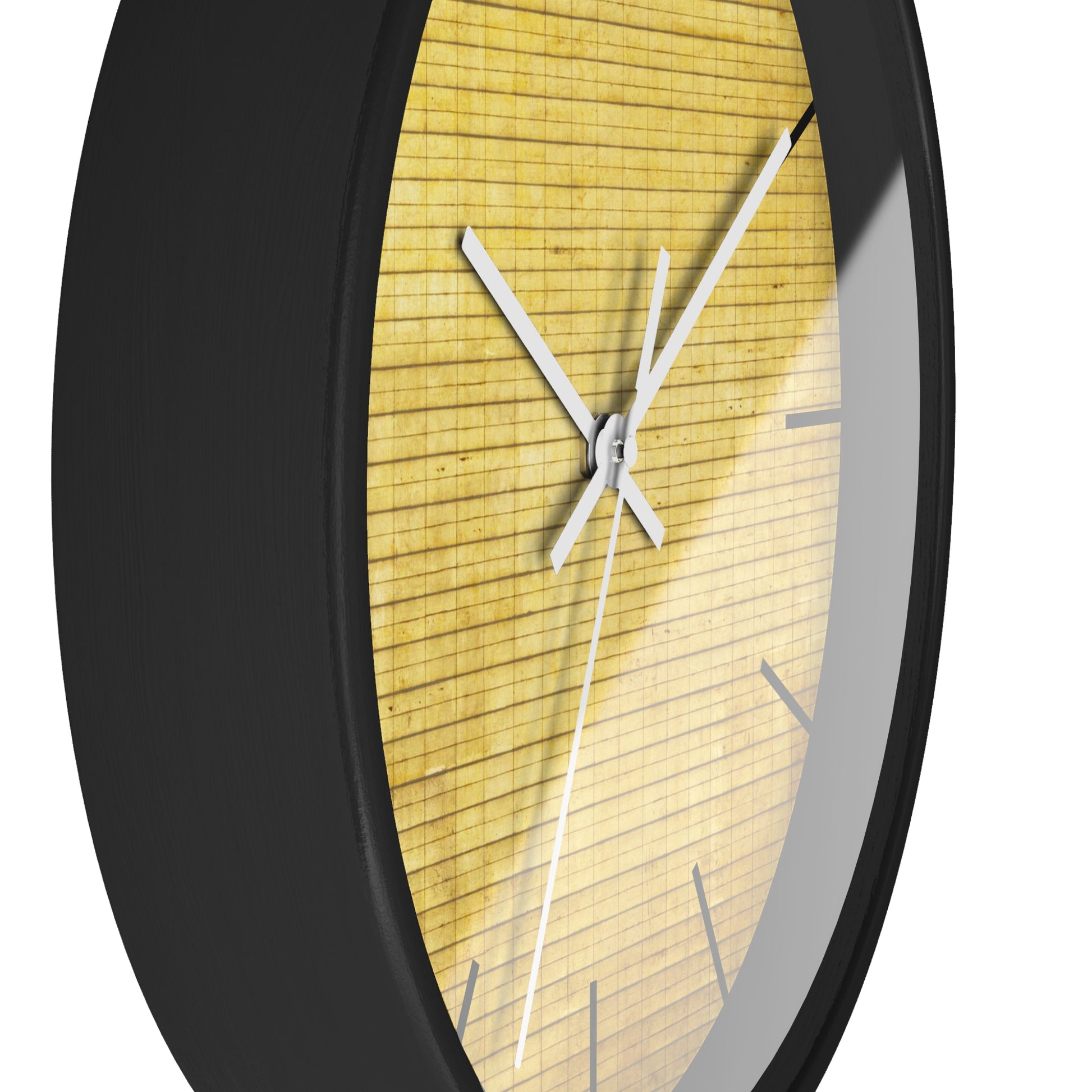 a black clock with a yellow face on a white background