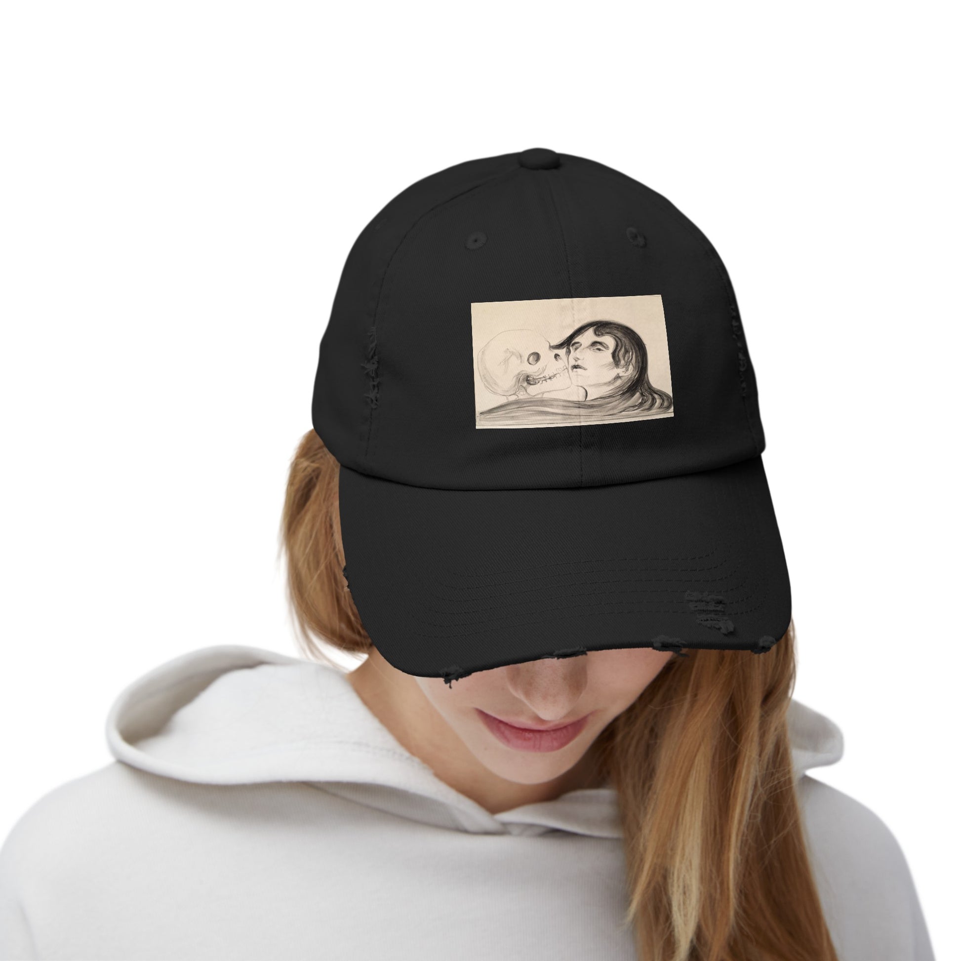 a woman wearing a black hat with a picture of a man and woman on it