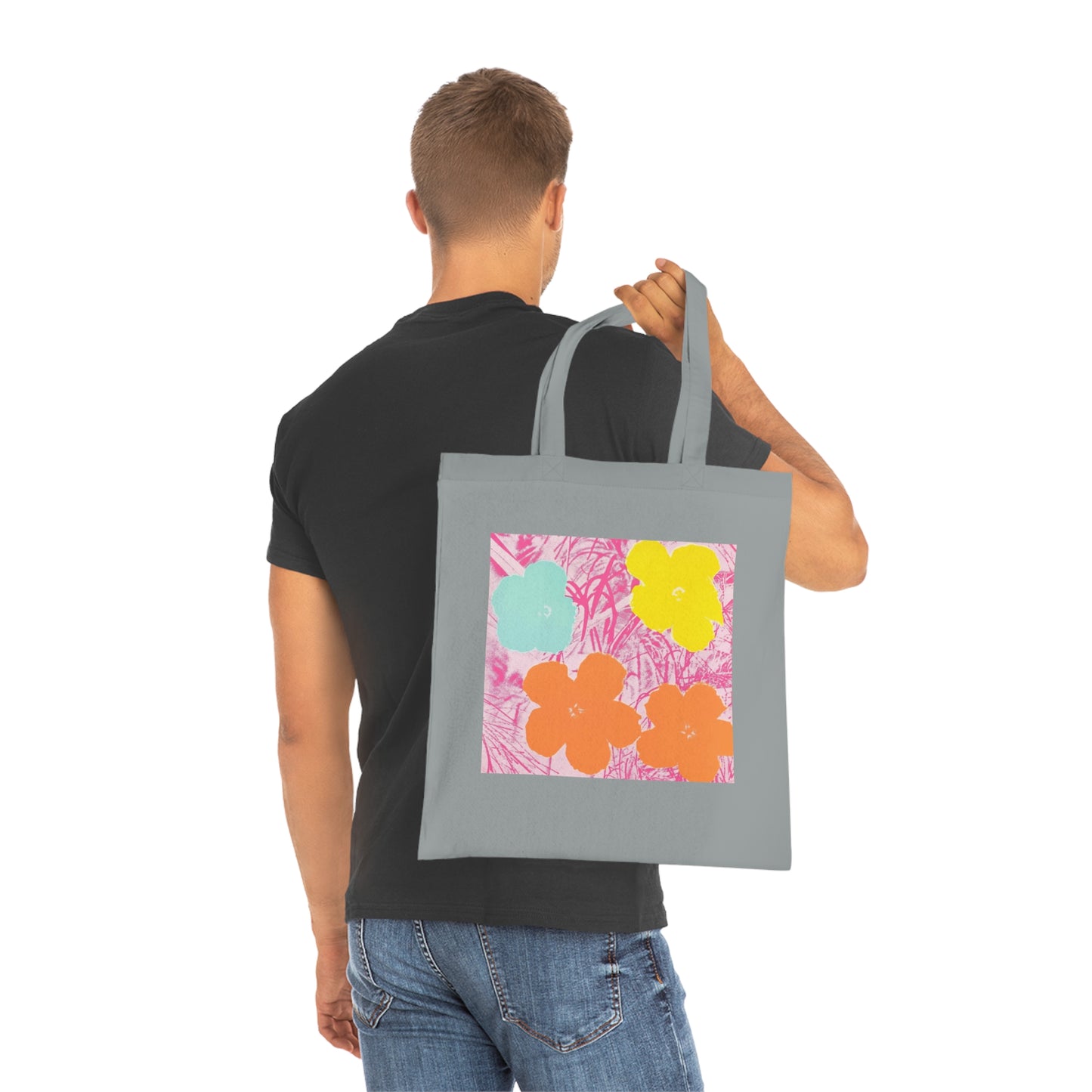 a man is holding a bag with a painting on it