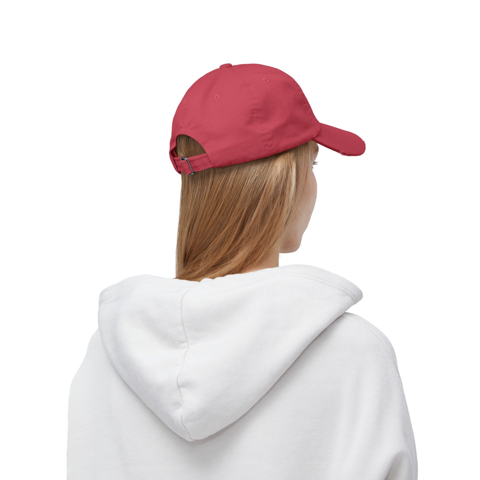 a woman wearing a red hat and a white sweatshirt