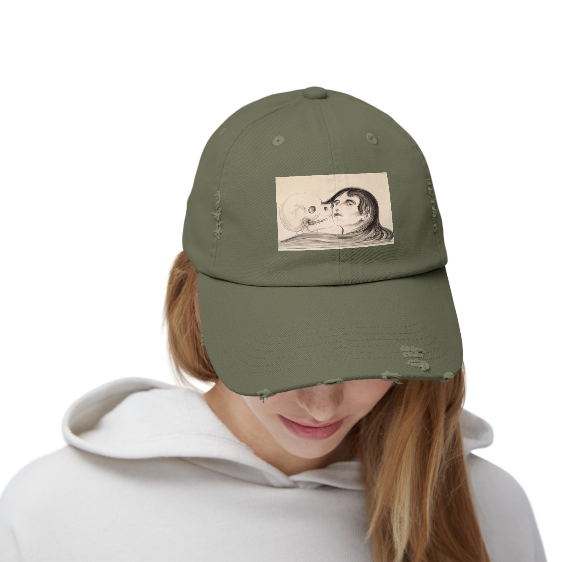 a woman wearing a green hat with a picture of a man and woman on it