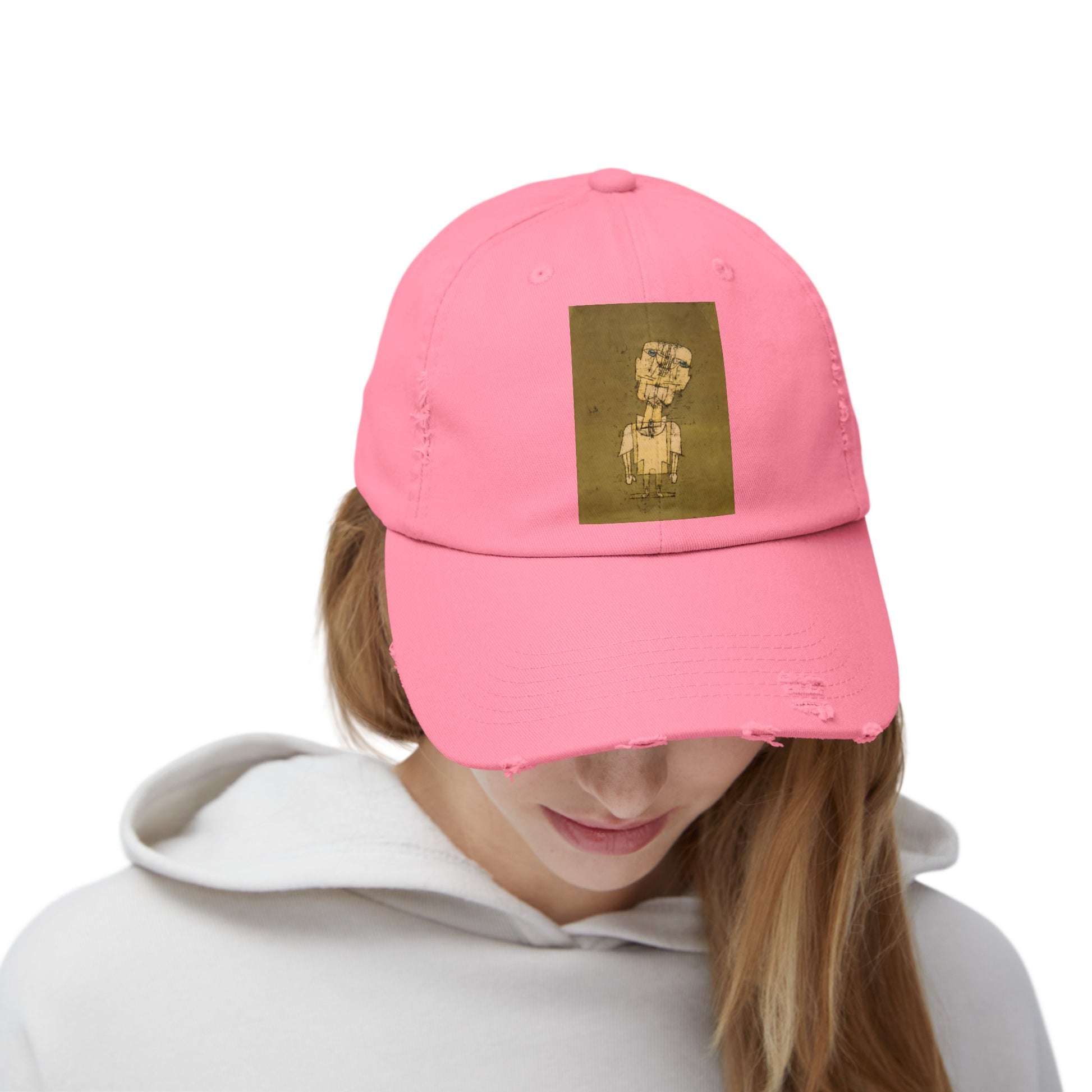 a woman wearing a pink hat with a picture of a dog on it