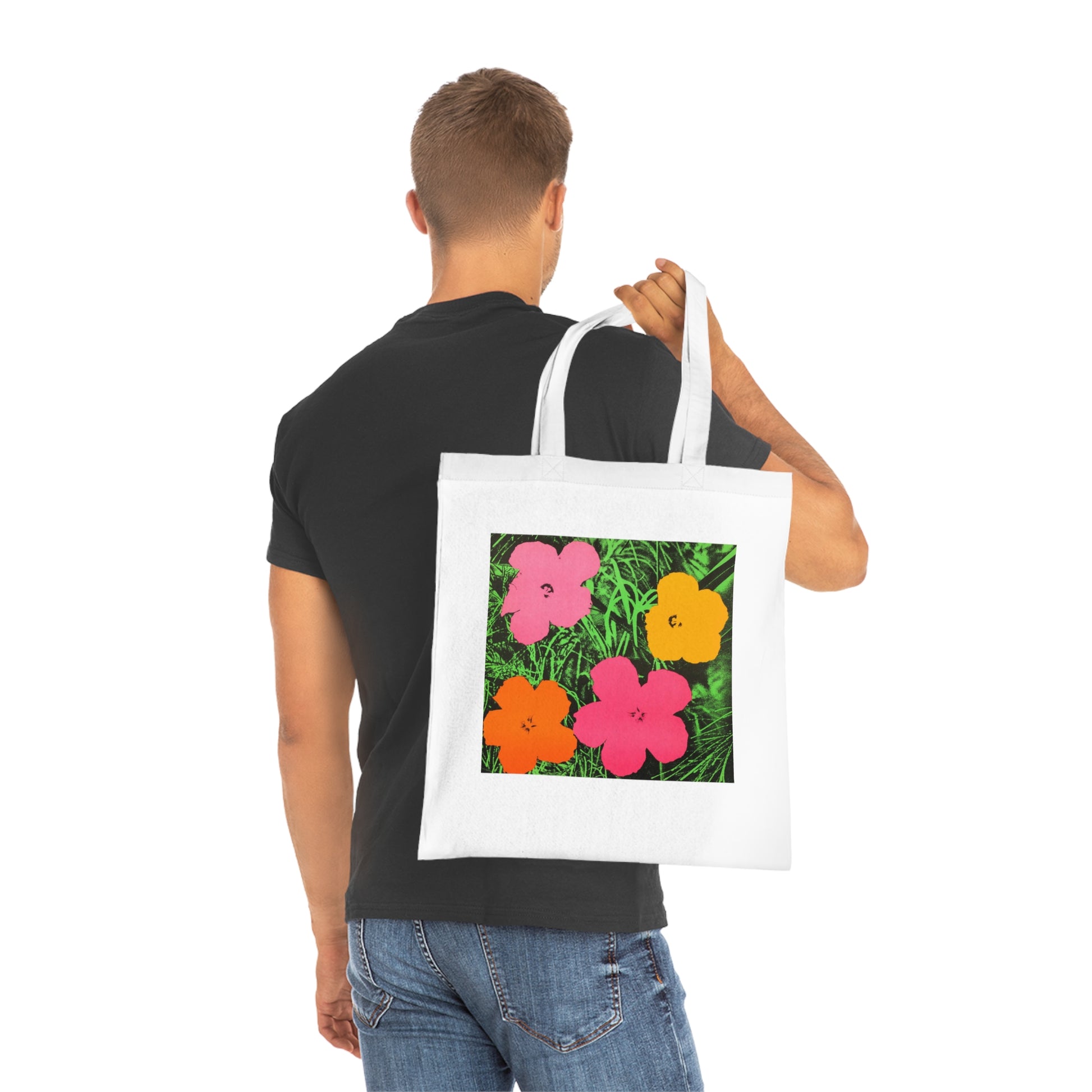 a man holding a bag with flowers on it