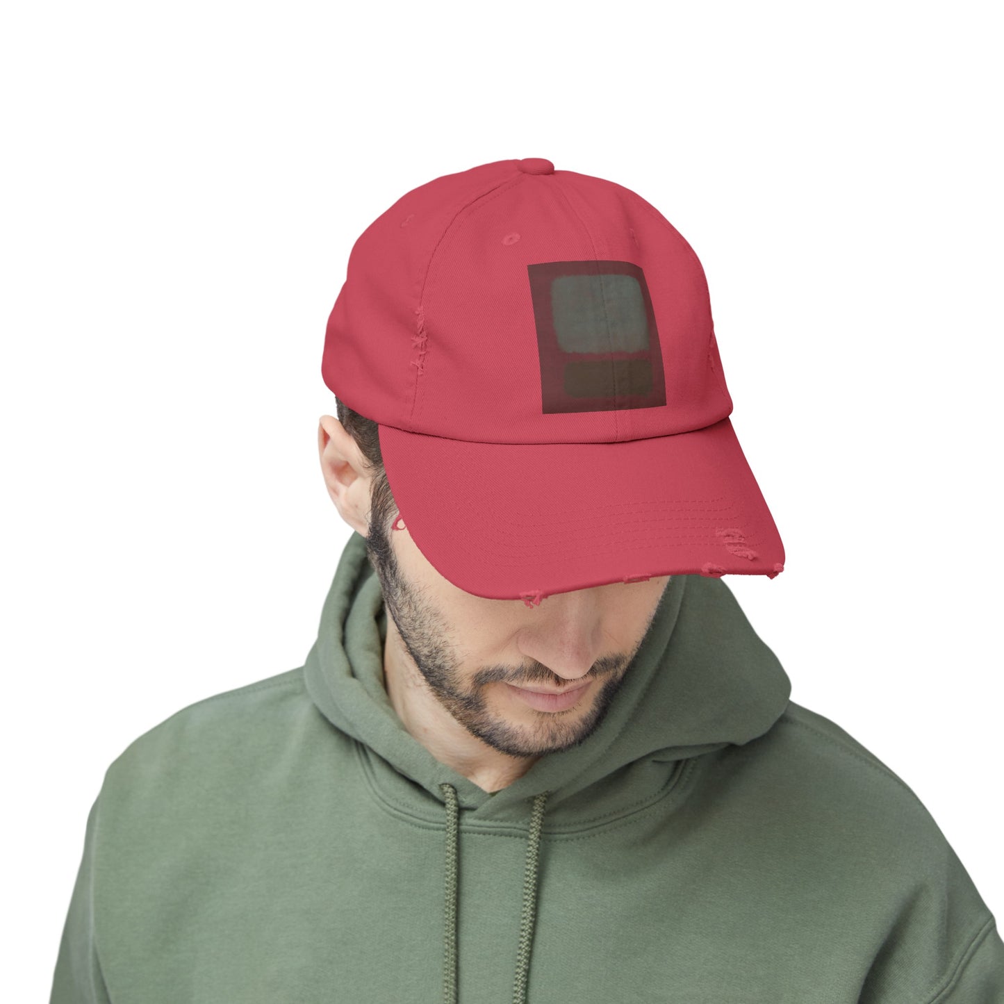 a man wearing a red hat and a green hoodie