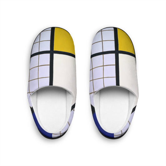 a pair of white slippers with a yellow and blue design