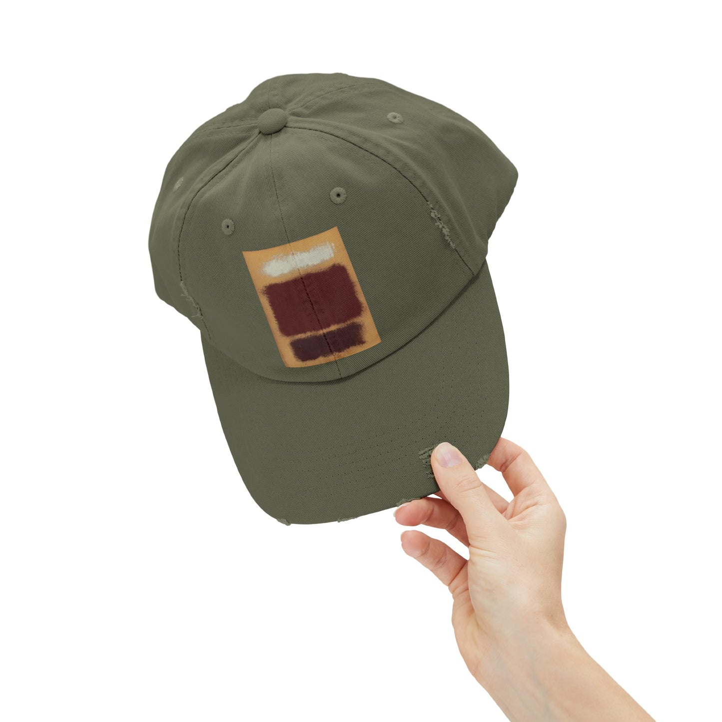 a person holding a green hat with a patch on it