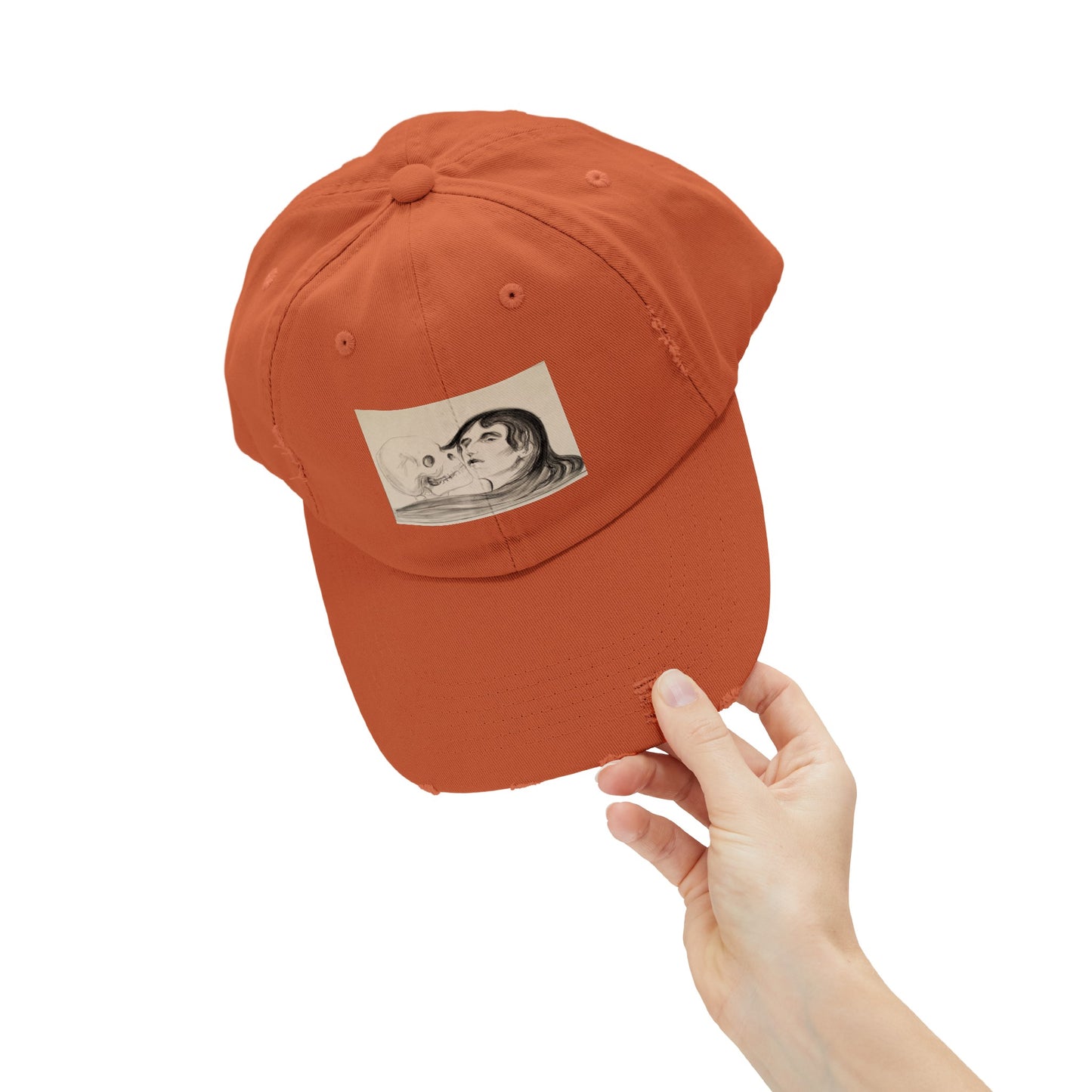 a person holding a baseball cap with a picture of a man on it