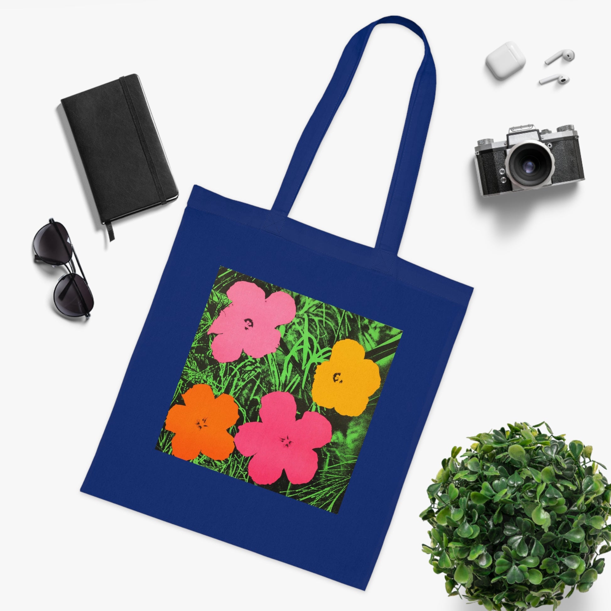 a blue tote bag with a picture of flowers on it