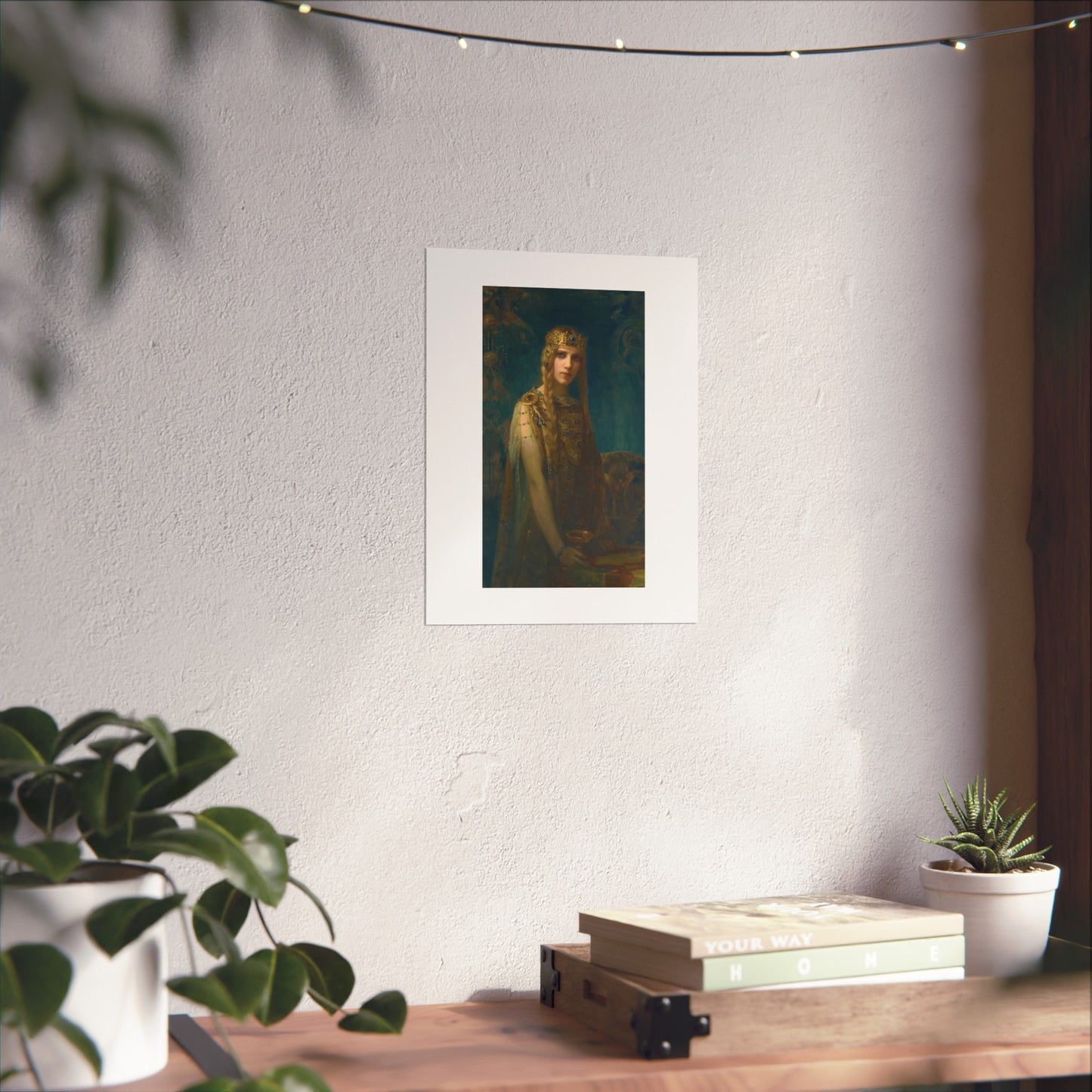 a picture of a woman is hanging on a wall