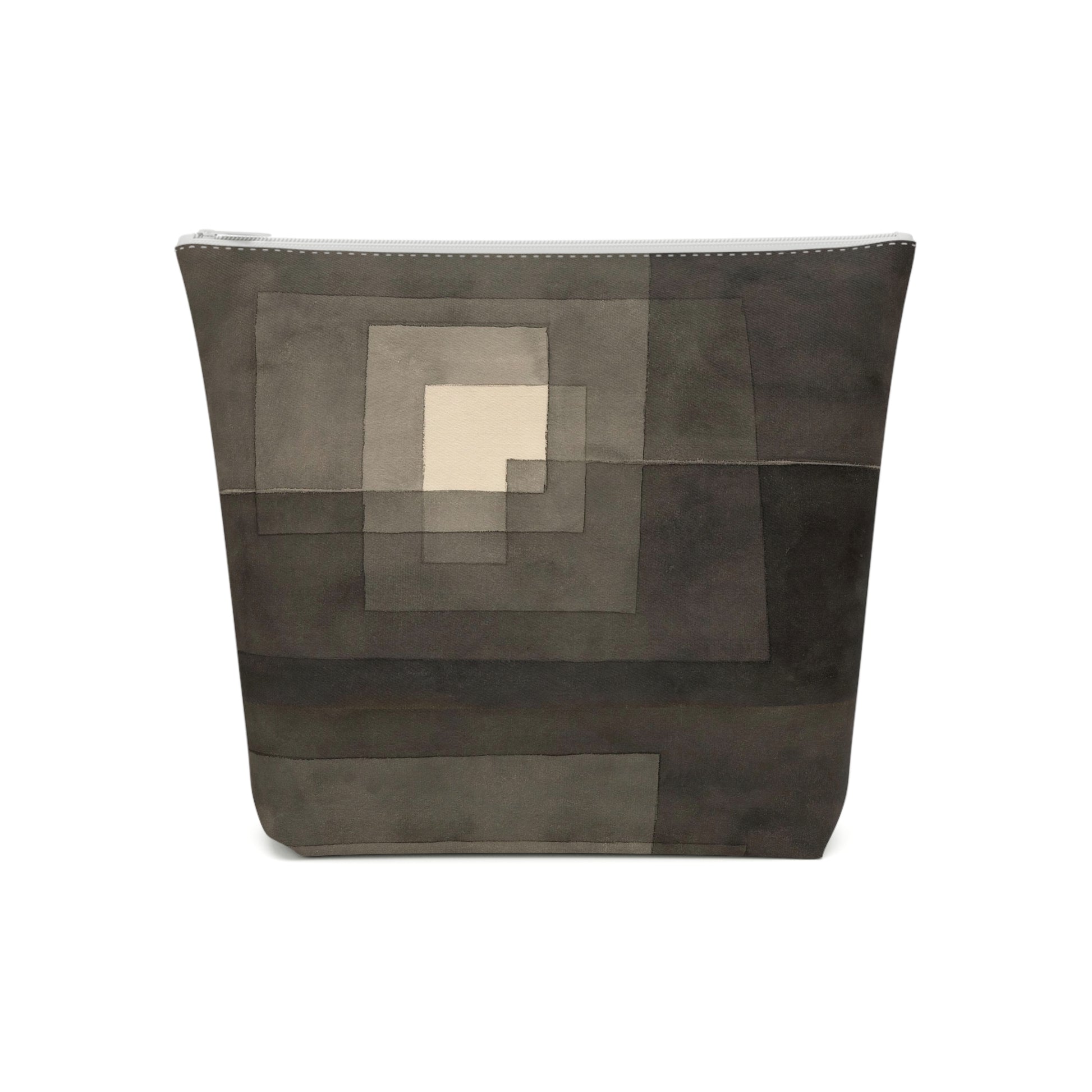 a large gray bag with a square pattern on it