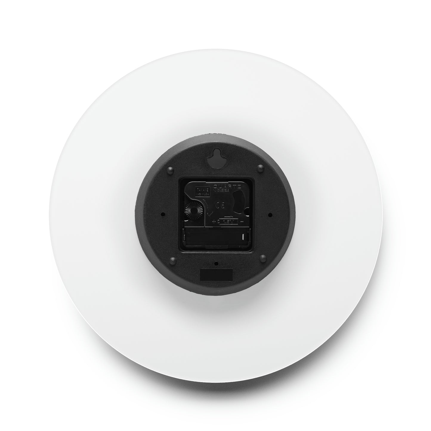a white plate with a black button on it