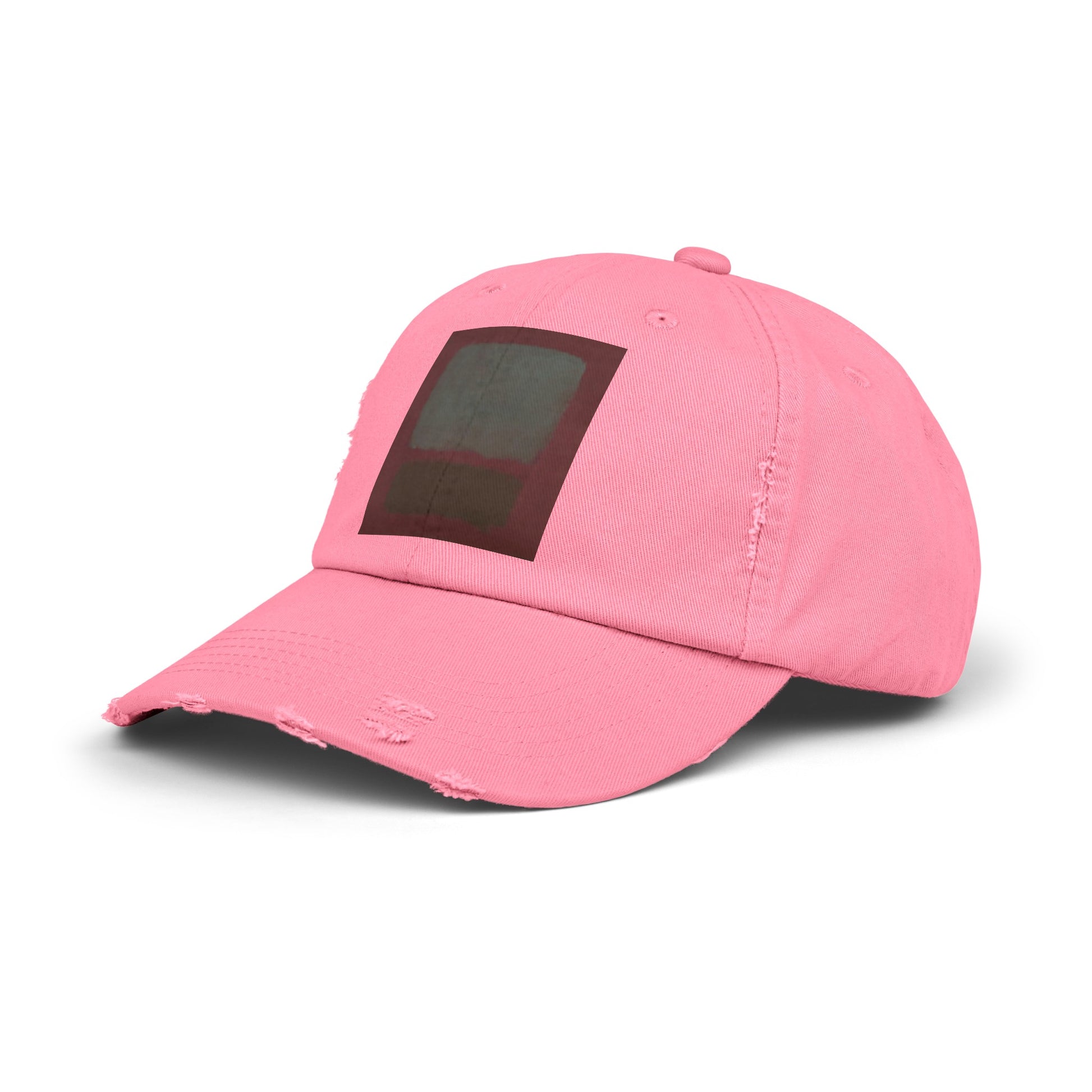 a pink hat with a black patch on the front of it