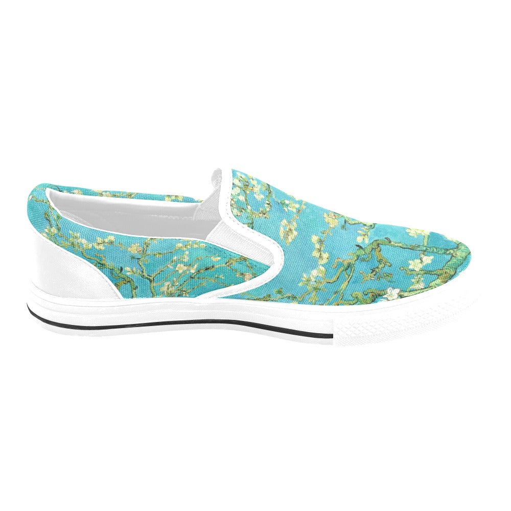 a pair of blue and white shoes with flowers on them