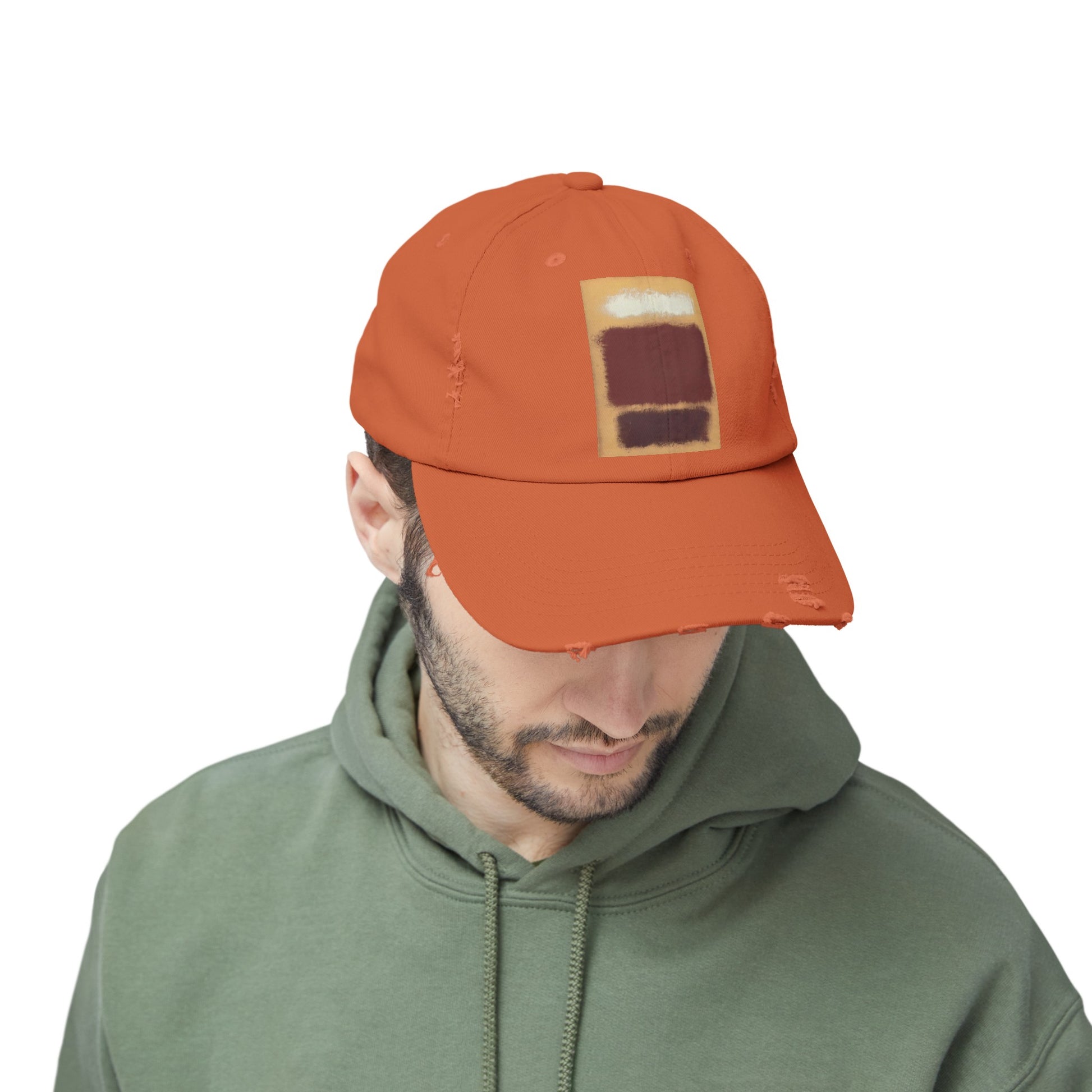 a man wearing an orange hat with a patch on it
