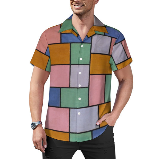 a man wearing a colorful shirt and black pants