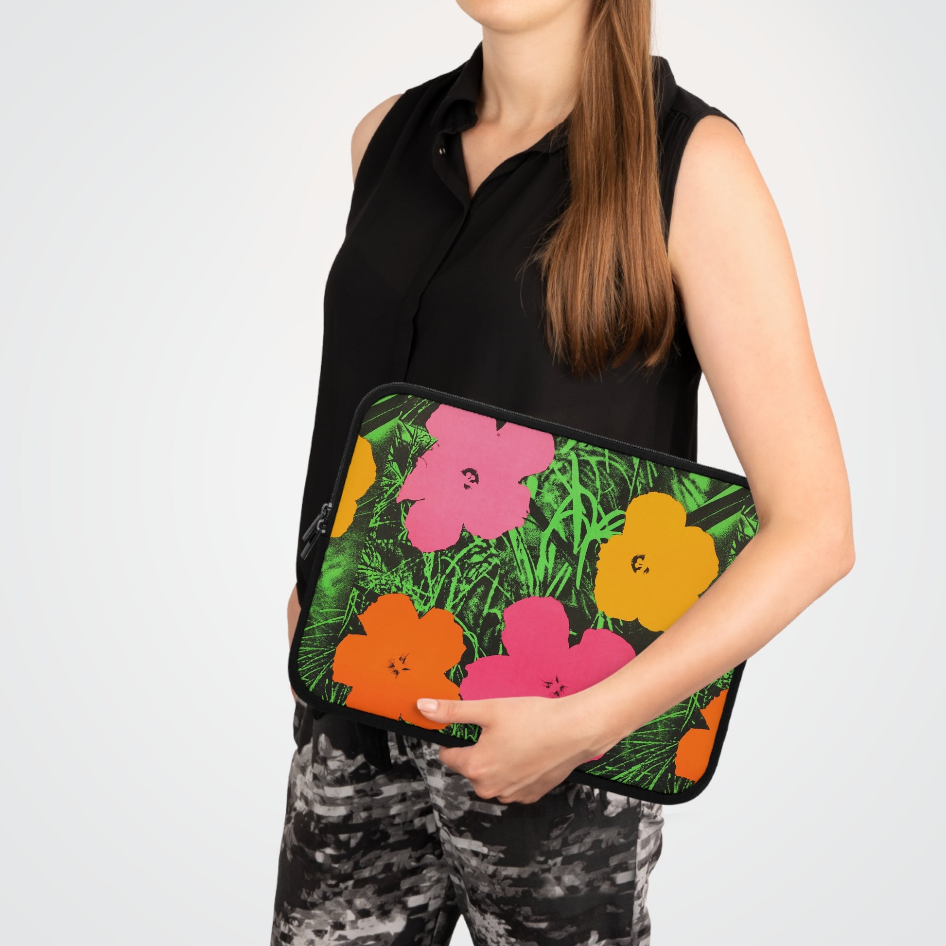 a woman in black shirt holding a colorful flowered purse