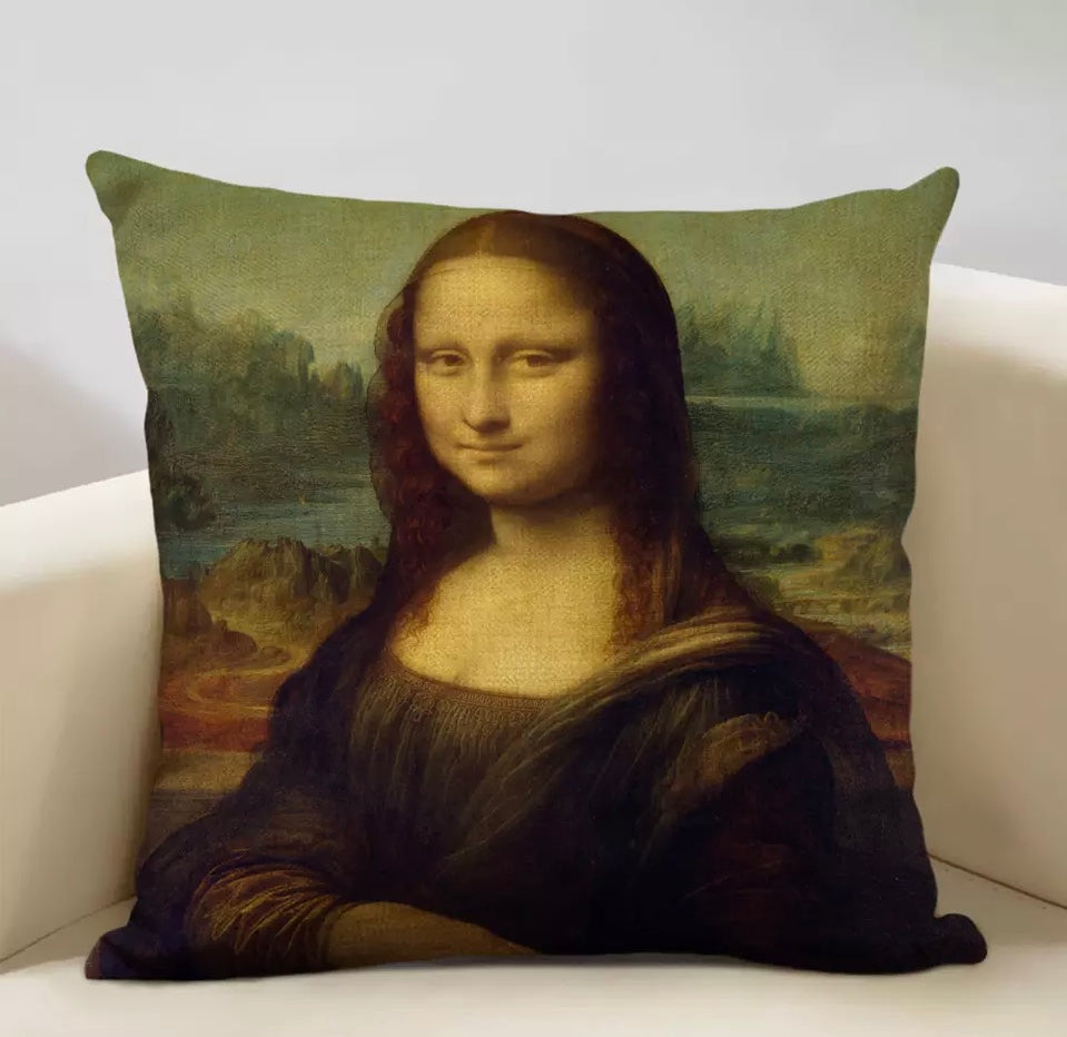a pillow with a painting of a woman's face on it