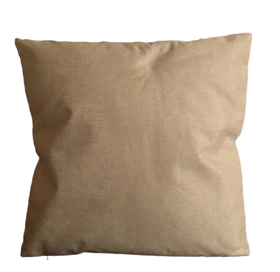 a beige pillow on a white background